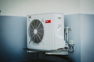 white and grey box fan of air conditioner