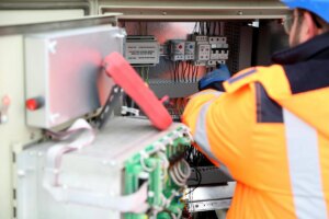 an electrician working on an electrical system