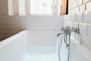 water running into bath through the tap